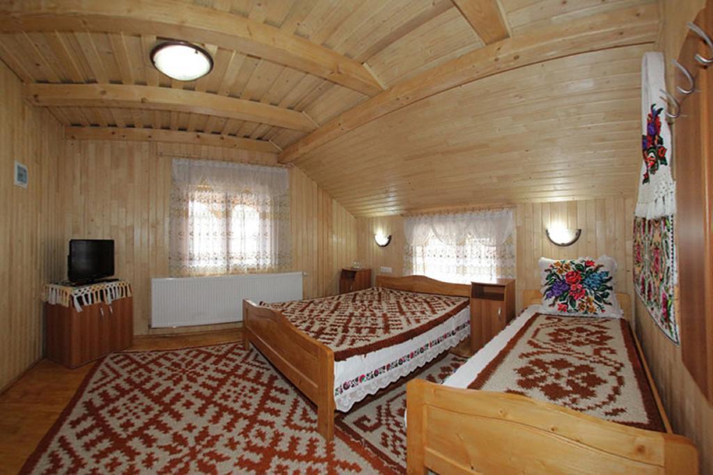 Pensiunea Sub Cetate La Matei Onceşti Camera foto